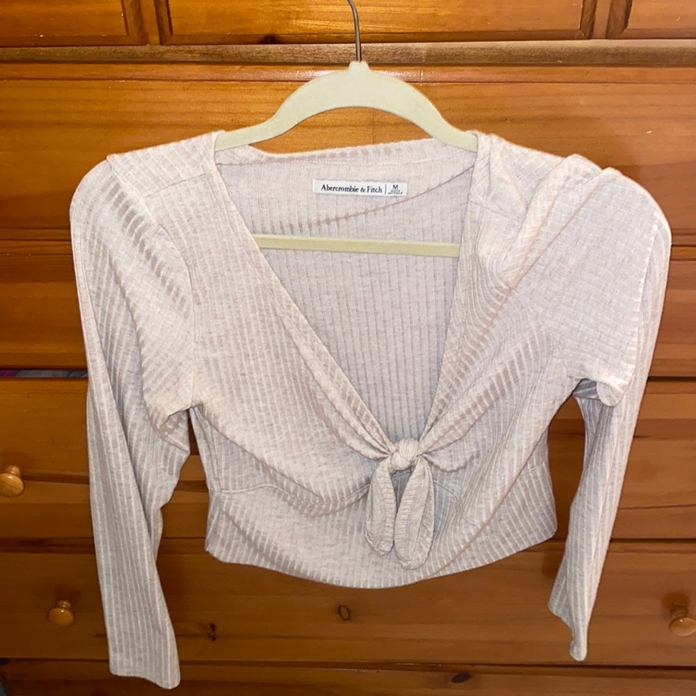 Cream colored long sleeve v neck shirt